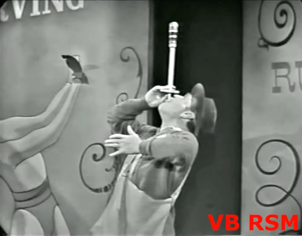 Red Skelton imitates the sword swallower in the Silent Spot