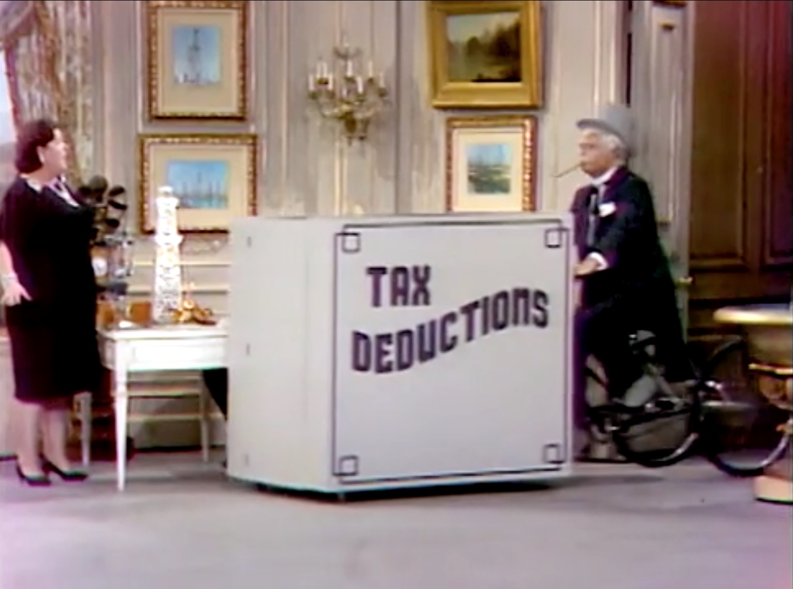 San Fernando Red and his box of questionable tax deductions in "It's a Treat to Beat a Cheat on the Mississippi Mud"