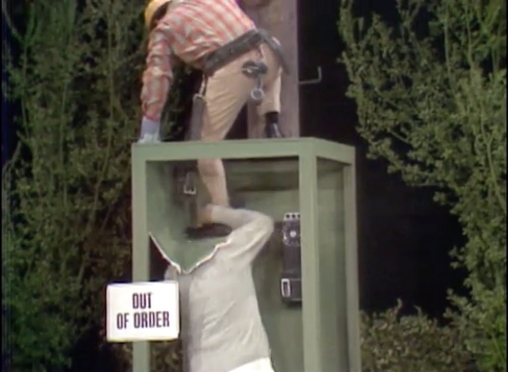 And the telephone repair man falls INTO the phone booth!