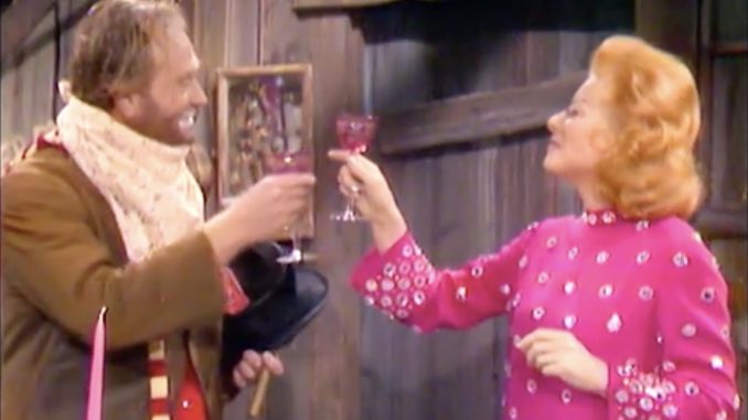 Freddie the Freeloader and Greer Garson toast each other a Merry Christmas