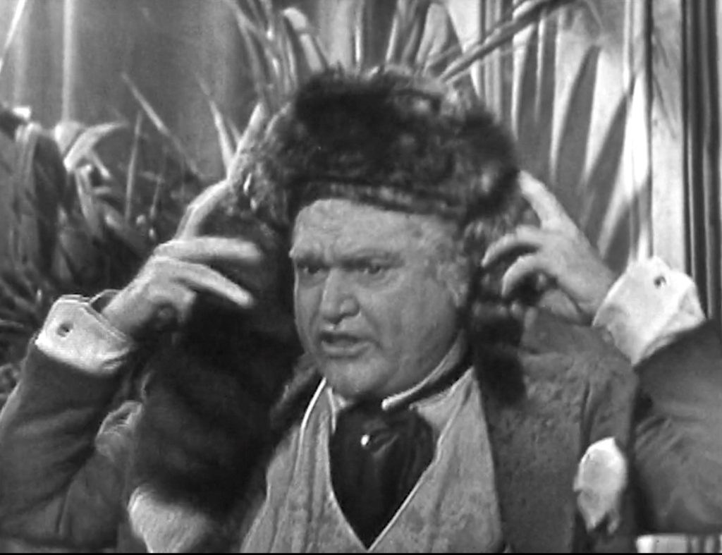 There's an irony in the two-faced San Fernando Red trying to schmooze votes with a coonskin cap with two tails!