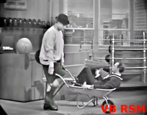 George Appleby returning from his 50 mile run - pushing Don Knotts in a wheelbarrow! in "Jerk and the Beanstalk"
