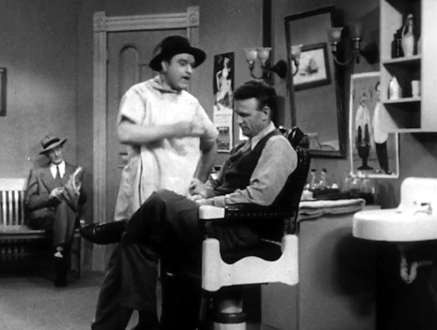 Willie Lump Lump about to sneeze off his customer's toupee in "Willie the Barber"